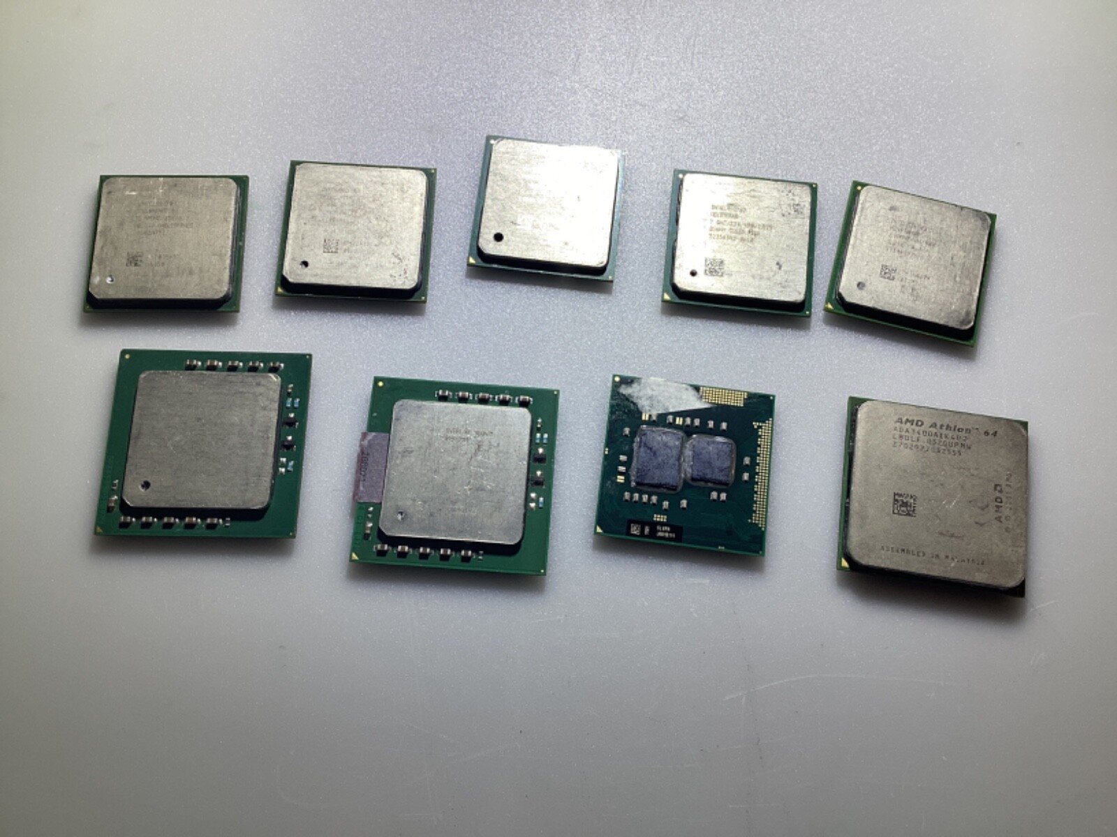 LOT OF NINE ASSORTED CPU PROCESSOR CHIPS INTEL, AMD, PREOWNED, CONDITION UNKNOWN