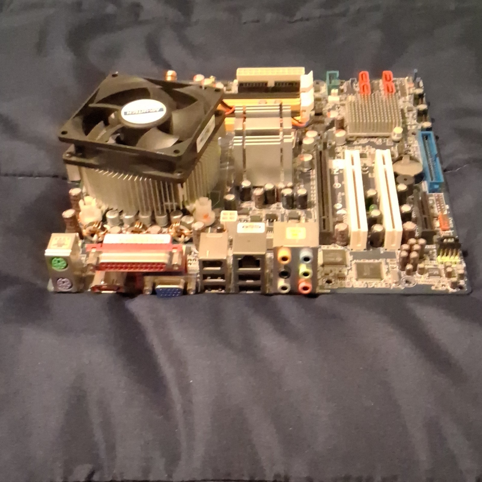 unknown brand motherboard, cpu combo with heatsink and cpu fan.